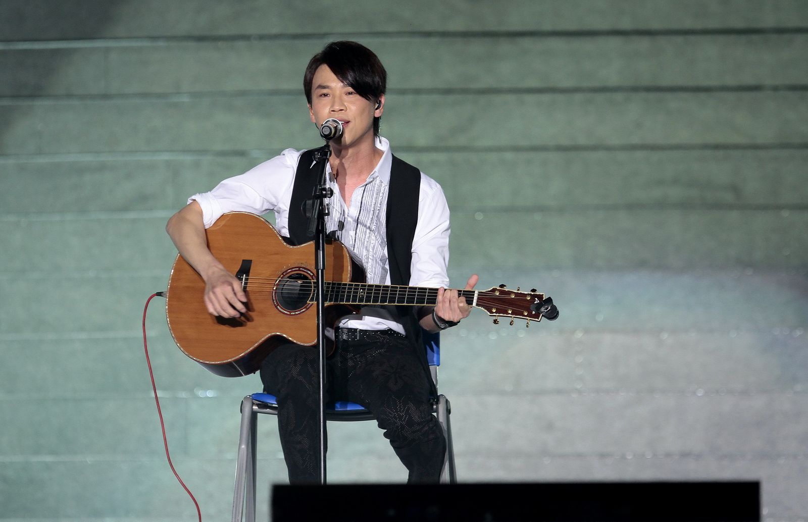 BEIJING CHINA  SEPTEMBER 25  Chinese singer David Tao performs on stage during the first KoreaChinaJapan Joint Concert...