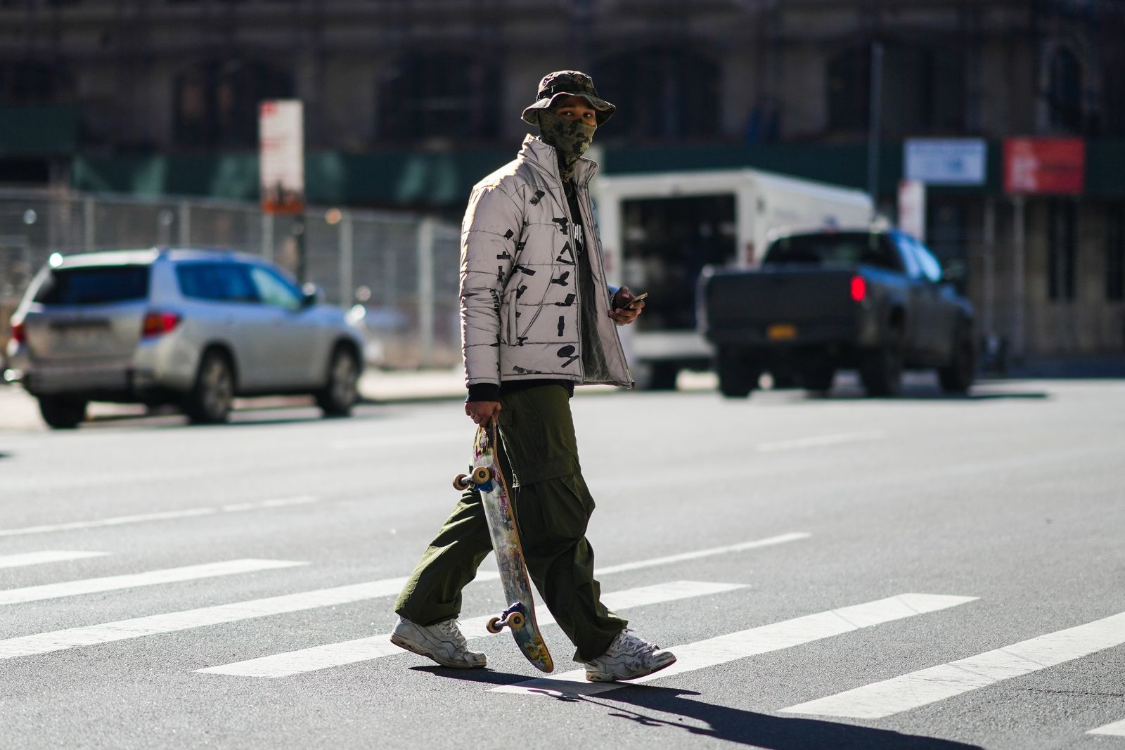 NEW YORK NEW YORK  FEBRUARY 11 A guest wears a khaki and black military print pattern bob a khaki military print pattern...