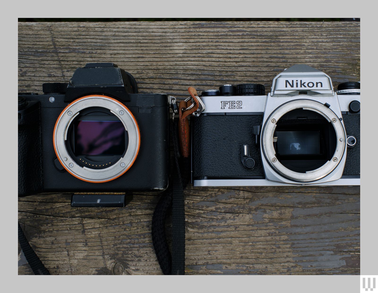Top view of two cameras facing upwards without lenses