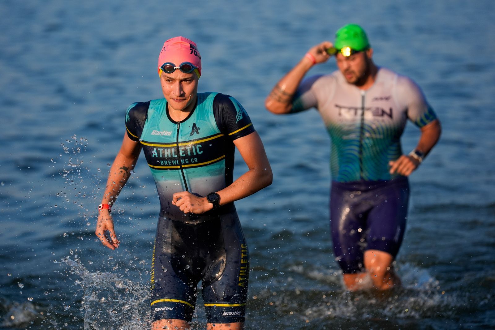 MUNCIE INDIANA  JULY 13 Age group athletes exit the swim course at the 2024 IRONMAN 70.3 Muncie on July 13 2024 in...