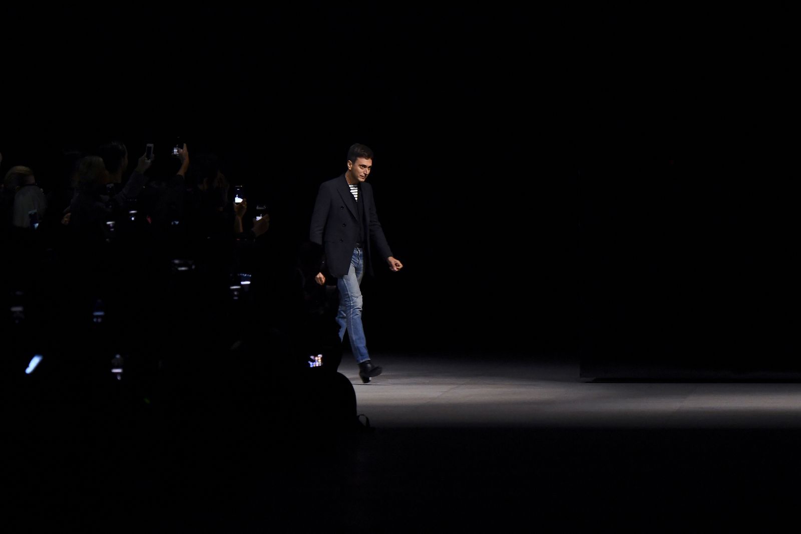 French fashion designer for Celine Hedi Slimane acknowledges the audience at the end of the Celine SpringSummer 2019...