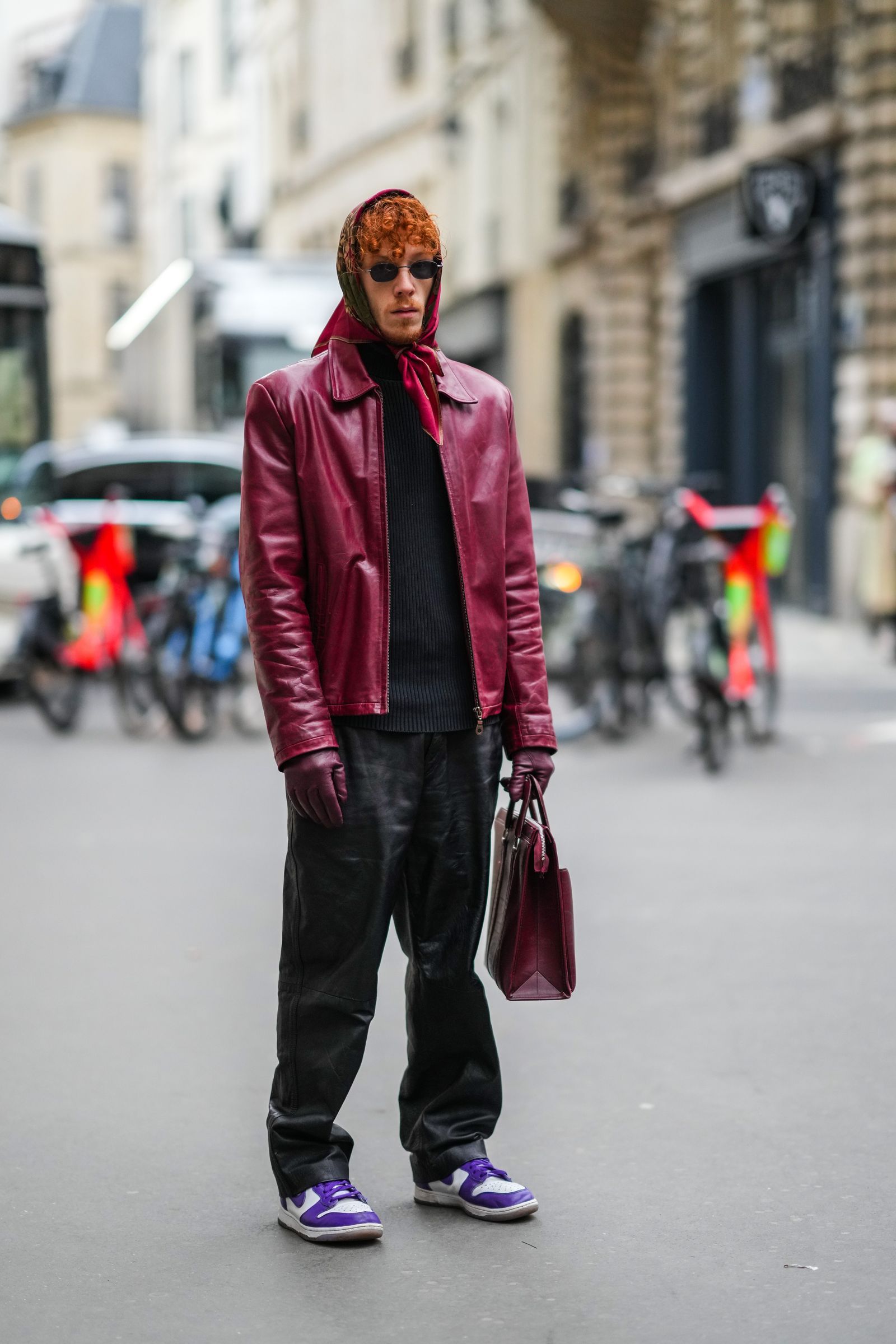 PARIS FRANCE  JANUARY 23 A guest wears a burgundy  brown  khaki flower print pattern scarf black sunglasses a black...