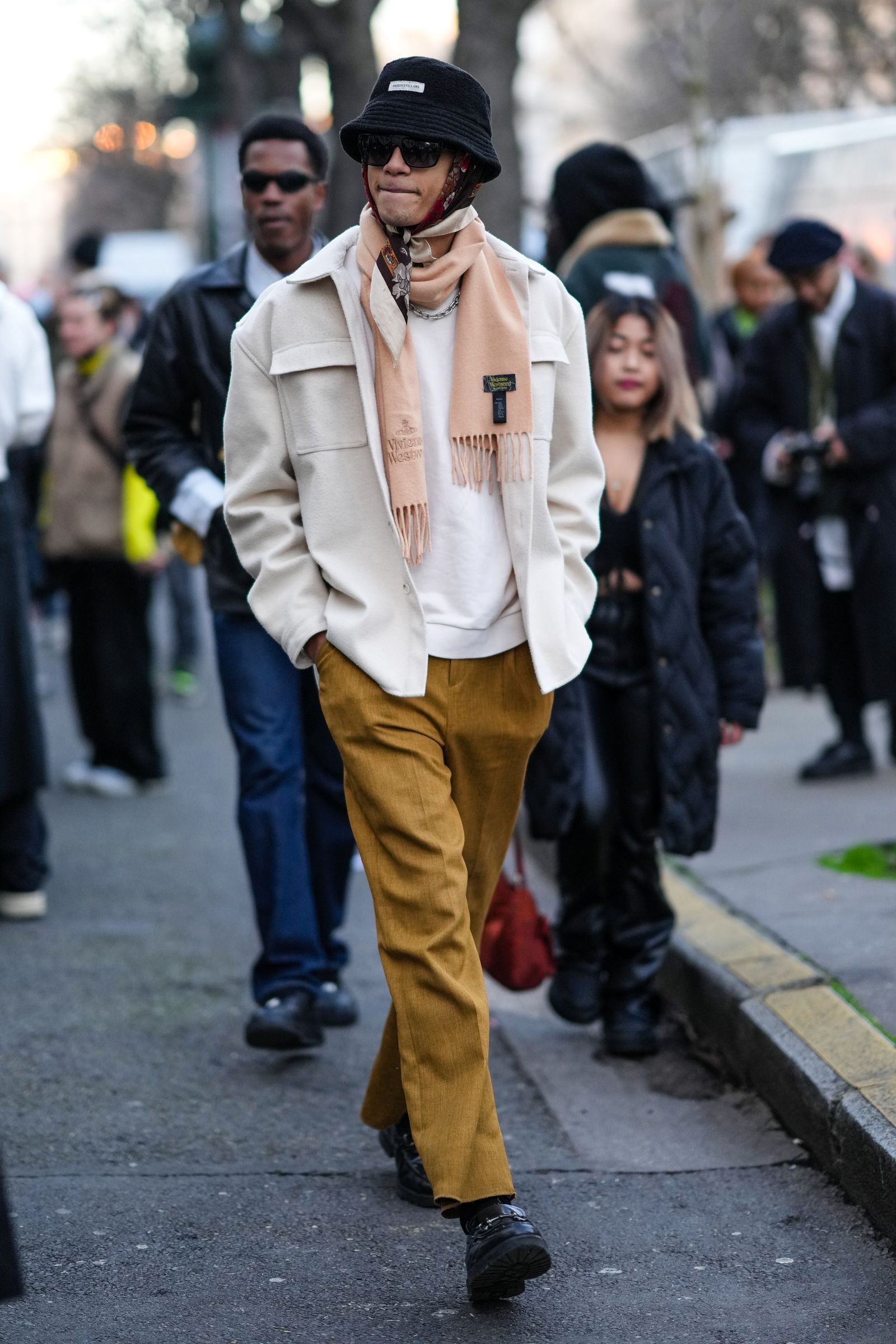 PARIS FRANCE  JANUARY 21 A guest wears a black bob hat a red  brown  white flower print pattern silk scarf as a head...