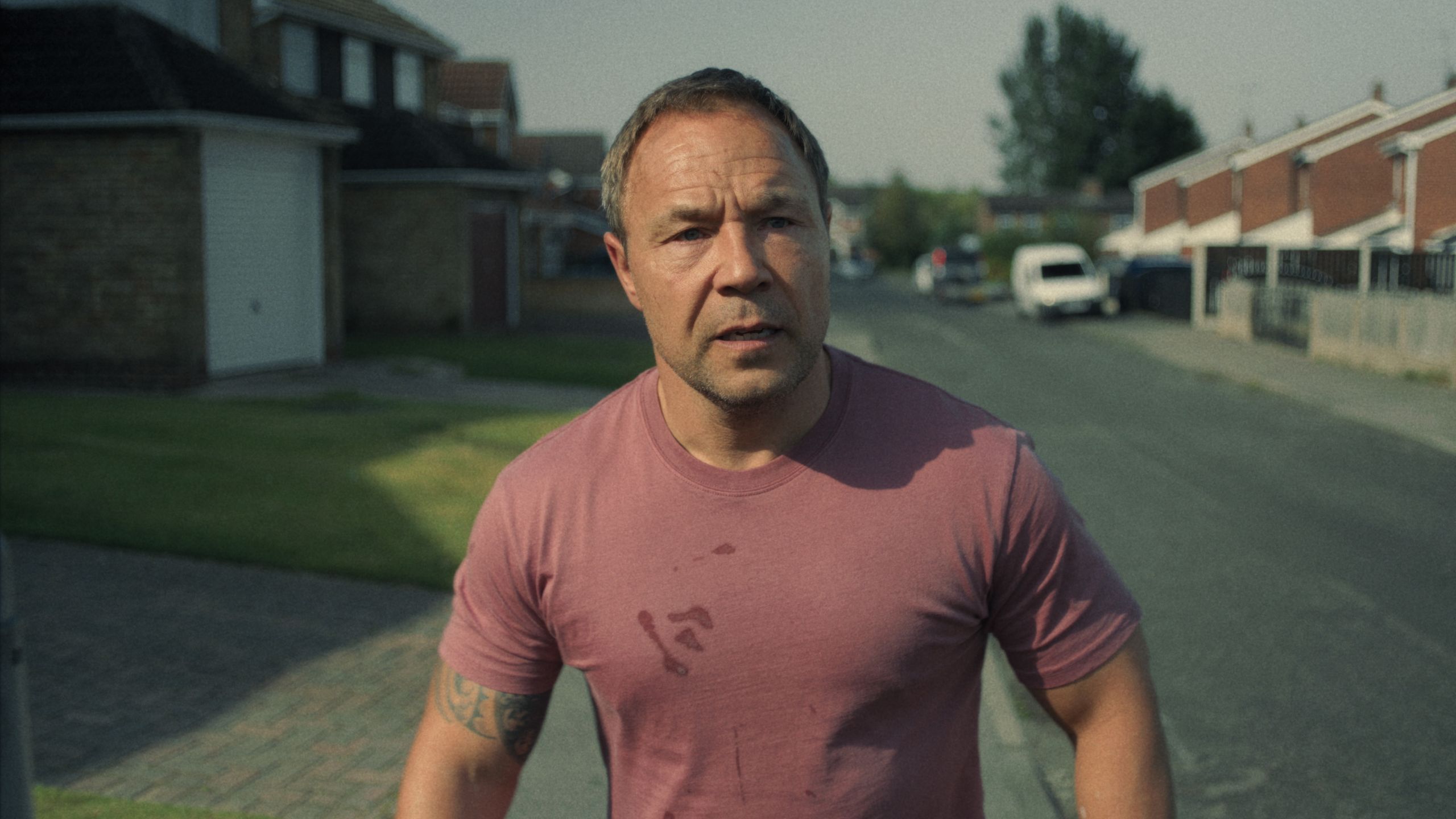 Image may contain Stephen Graham Clothing TShirt Face Head Person Photography Portrait City Road and Street