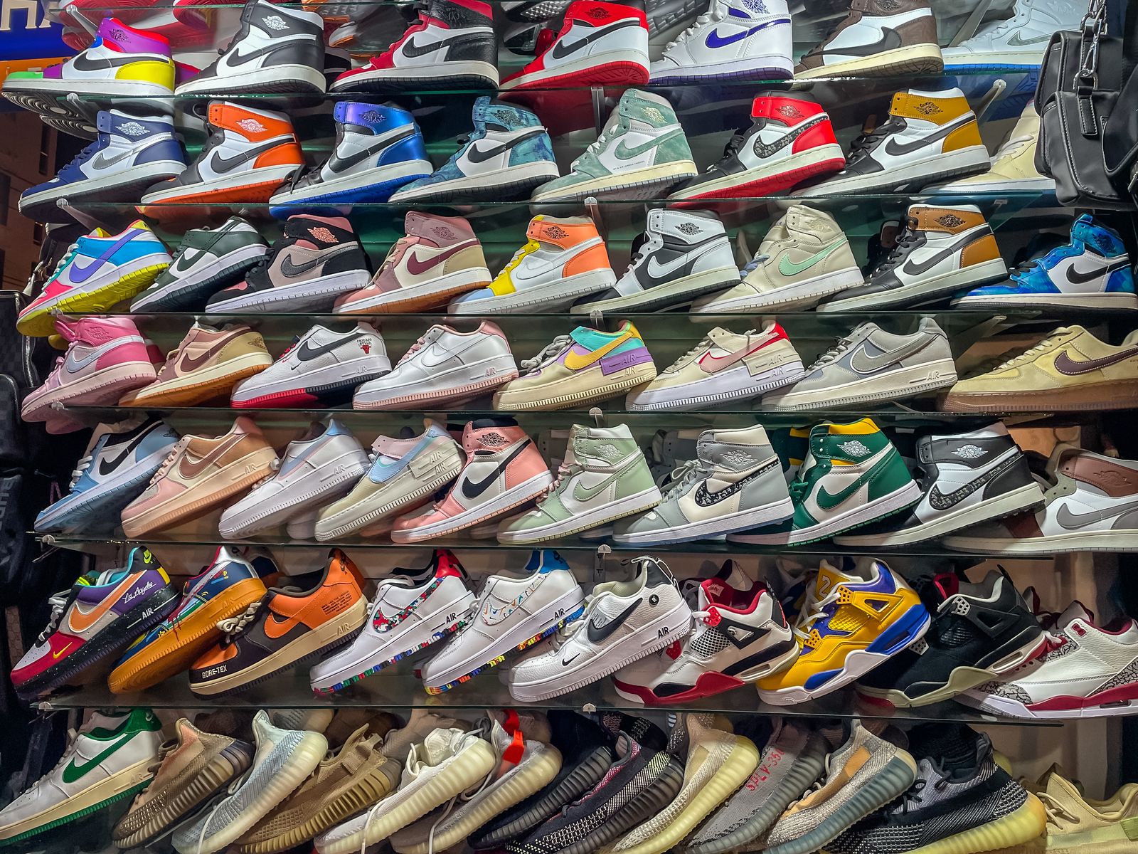 Phuket Thailand  May 4 2022 Rows of Counterfeit Fake Poor quality Trainers such as Nike Air Jordans and Adidas being...
