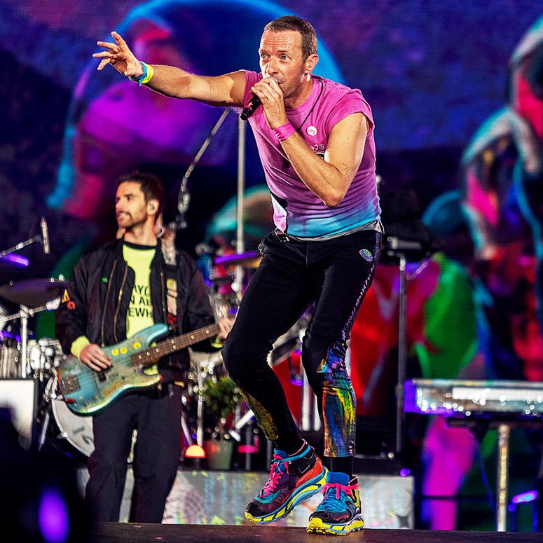 Image may contain: Chris Martin, Guy Berryman, Leisure Activities, Music, Musical Instrument, Musician, Performer, and Person