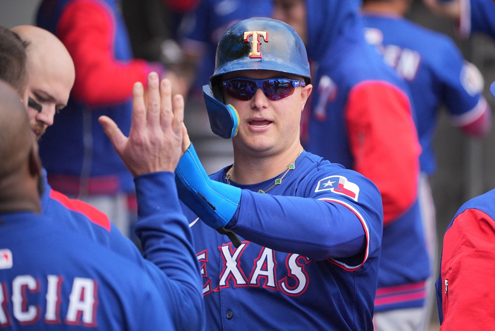 CHICAGO IL  MAY 24 Joc Pederson 4 of the Texas Rangers celebrates in the dugout during the game between the Texas...