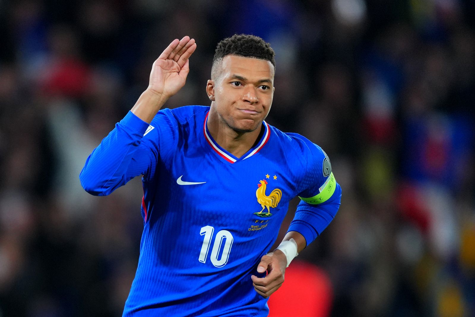 PARIS FRANCE  NOVEMBER 13 Kylian Mbappe of France celebrates scoring his team's first goal from the penalty spot during...