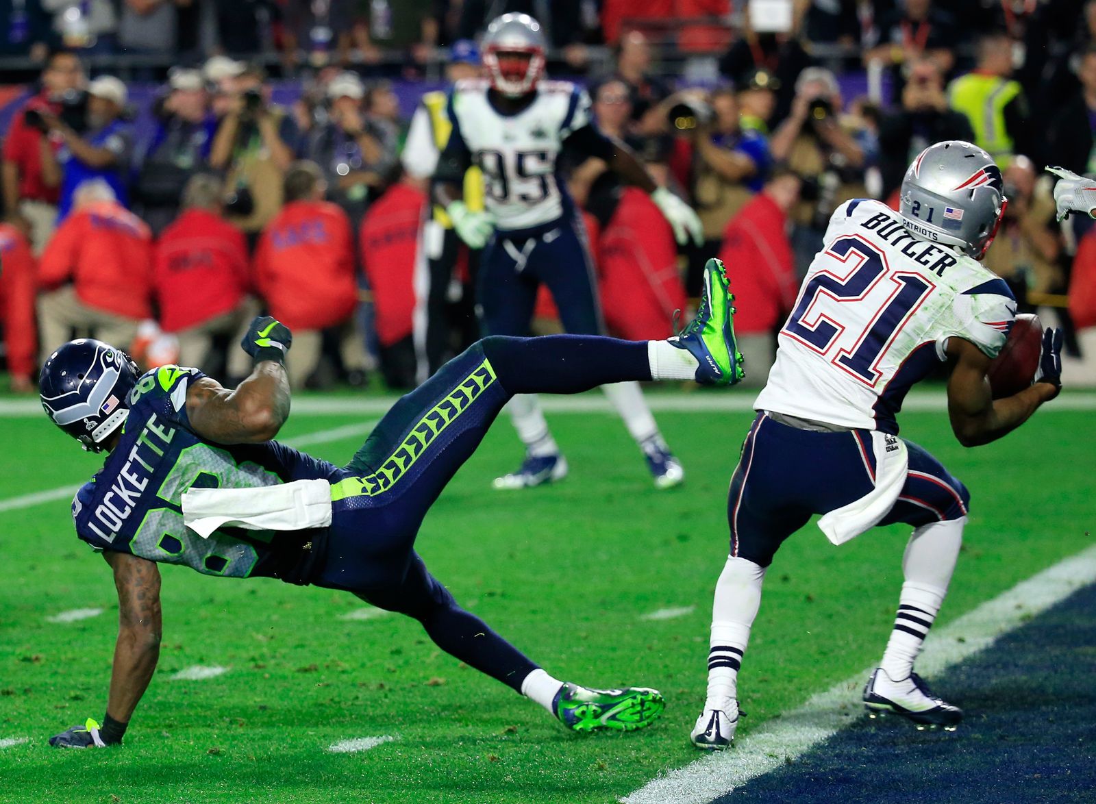 GLENDALE AZ  FEBRUARY 01  Malcolm Butler 21 of the New England Patriots intercepts a pass by  Russell Wilson 3 of the...
