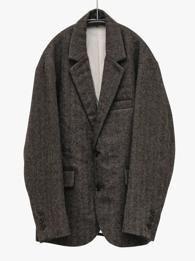Image may contain Blazer Clothing Coat Jacket Formal Wear and Suit